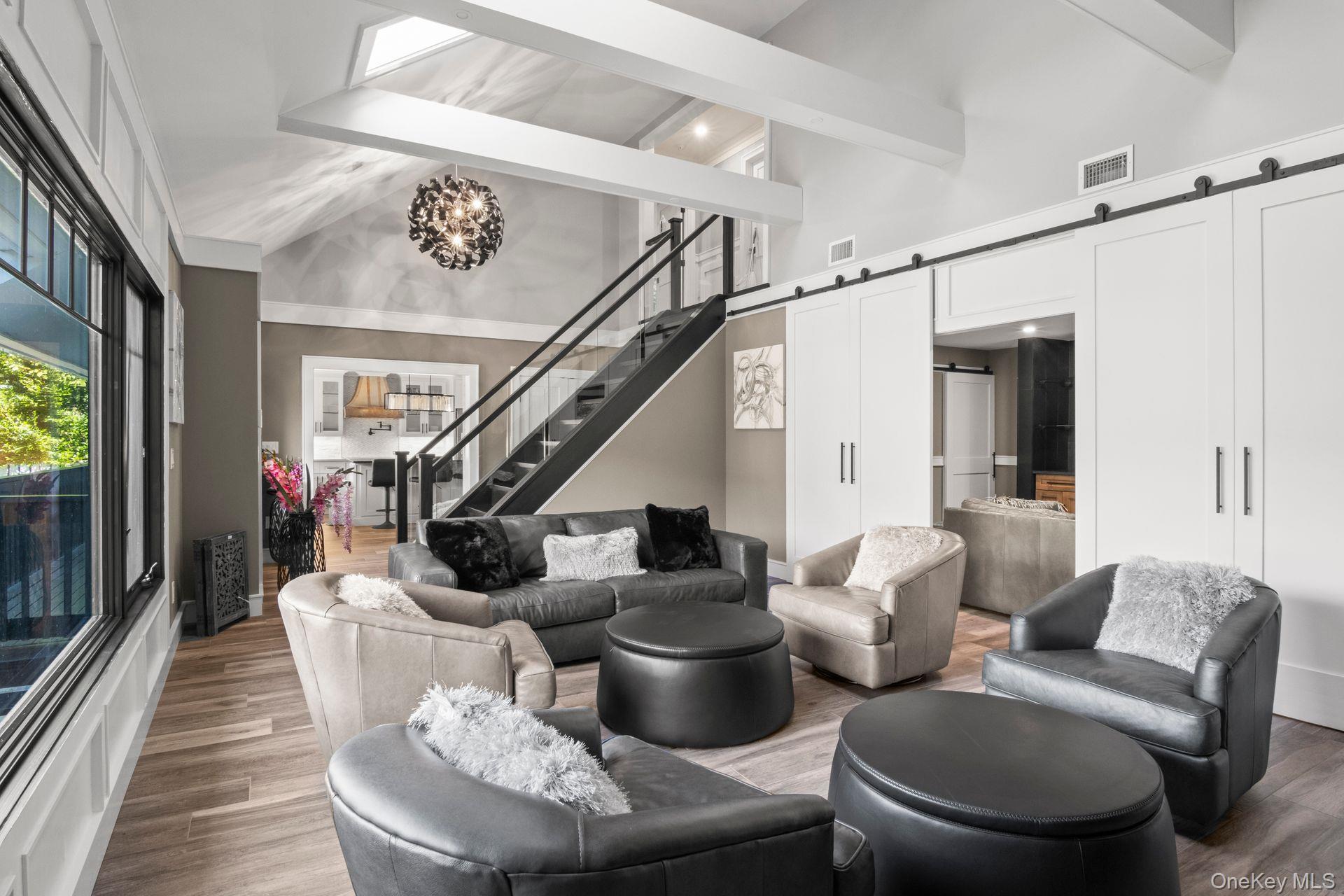 131 Fleets Cove Road Huntington, NY 11743 - Photo 15 of 41 a living room with furniture and a potted plant