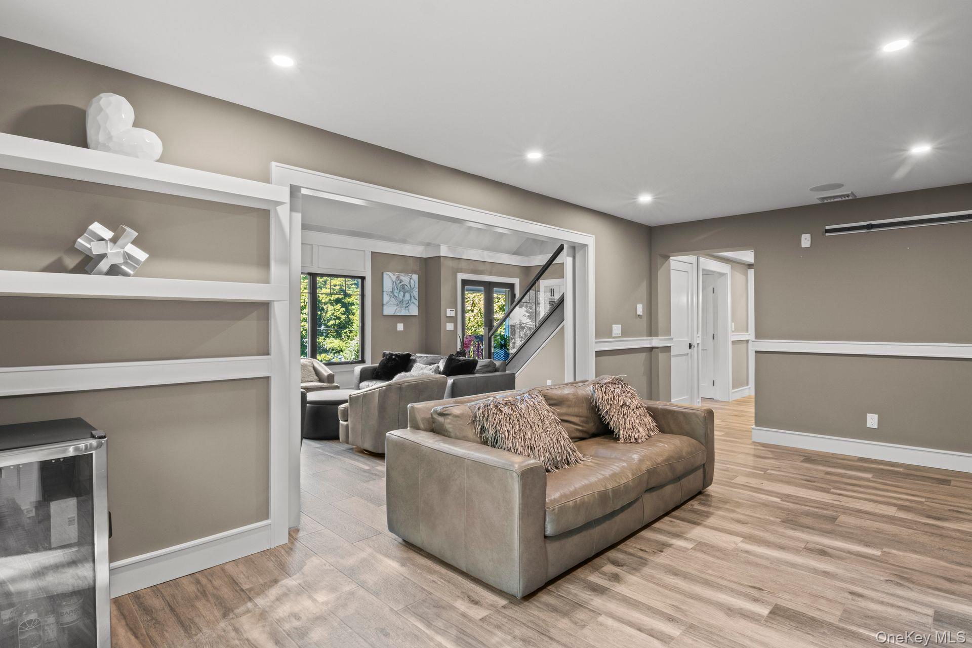 131 Fleets Cove Road Huntington, NY 11743 - Photo 18 of 41 a living room with furniture and a wooden floor