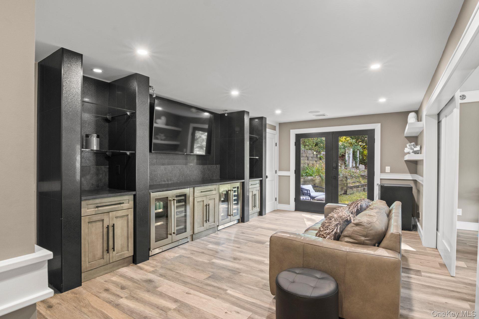 131 Fleets Cove Road Huntington, NY 11743 - Photo 19 of 41 a living room with furniture and a flat screen tv