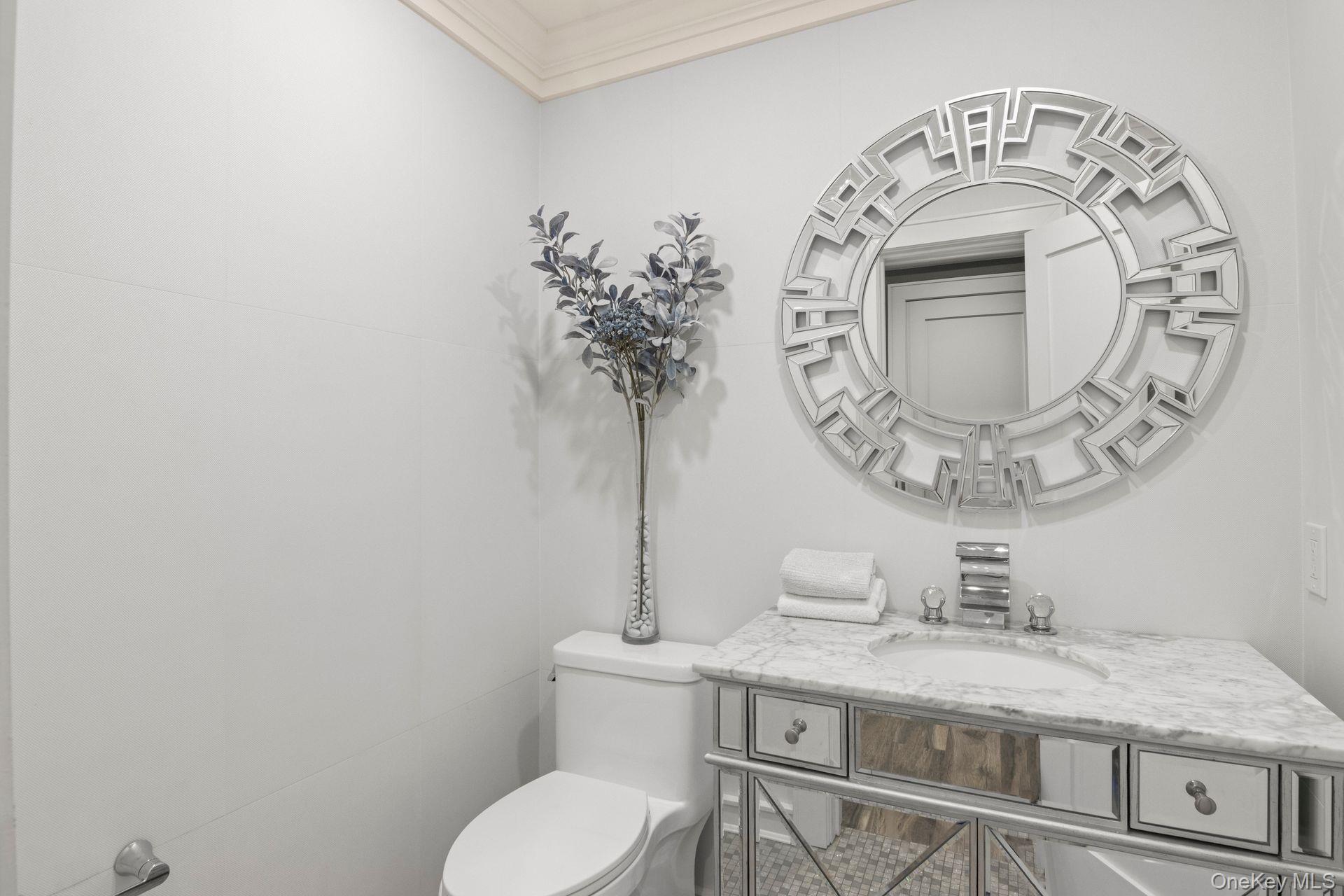 131 Fleets Cove Road Huntington, NY 11743 - Photo 21 of 41 a bathroom with a toilet and a sink