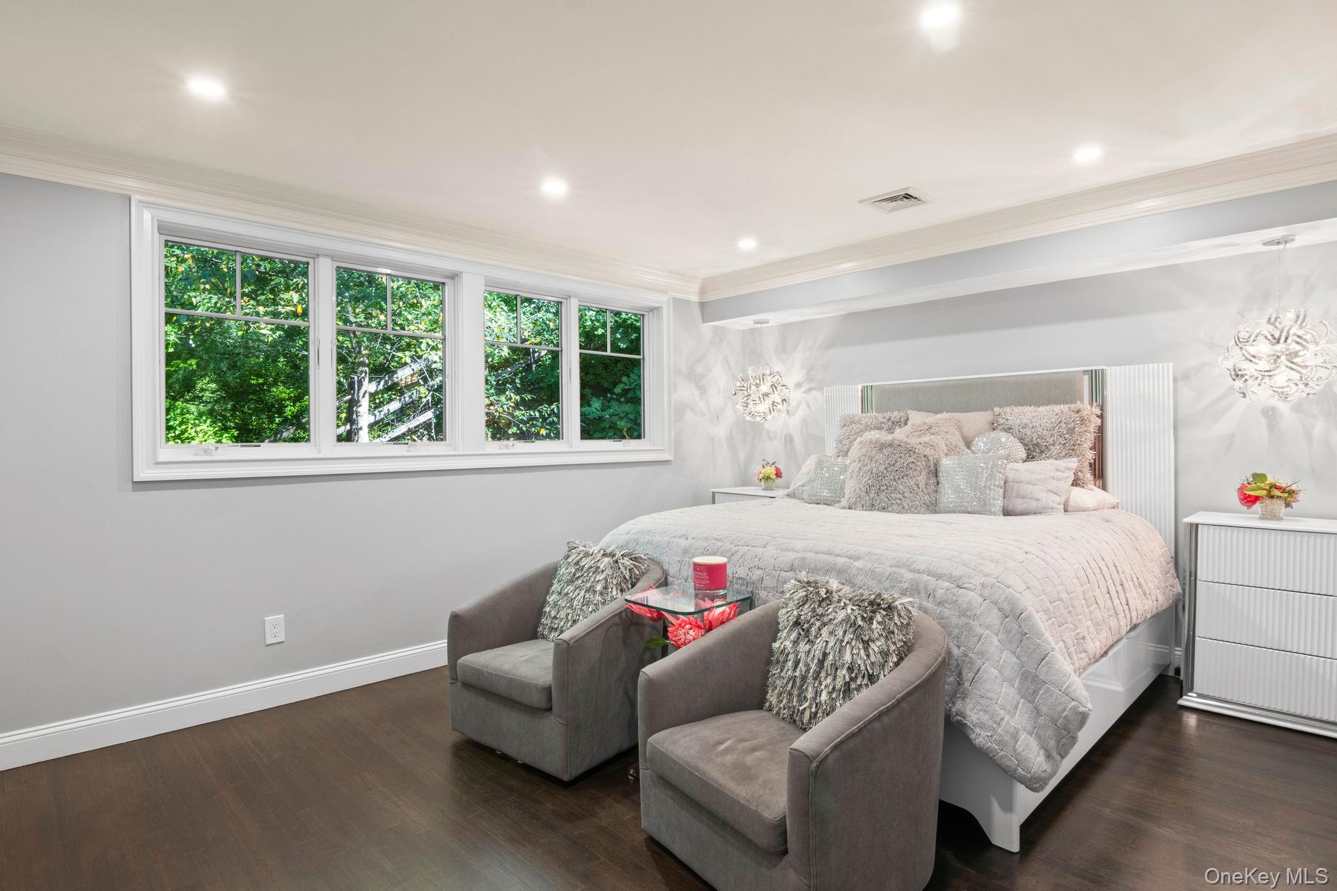 131 Fleets Cove Road Huntington, NY 11743 - Photo 22 of 41 a bedroom with a bed and a couch