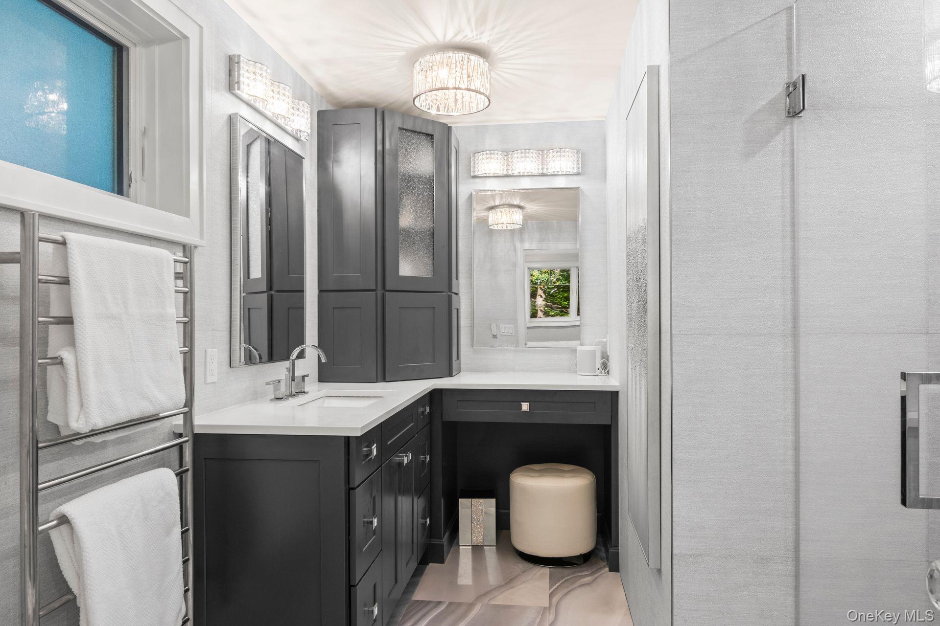 131 Fleets Cove Road Huntington, NY 11743 - Photo 26 of 41 a bathroom with a sink a toilet and mirror