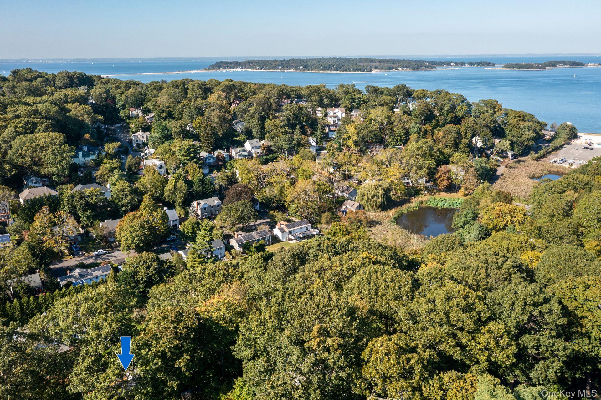 131 Fleets Cove Road Huntington, NY 11743 - Photo 35 of 41 an aerial view of a houses with a lake