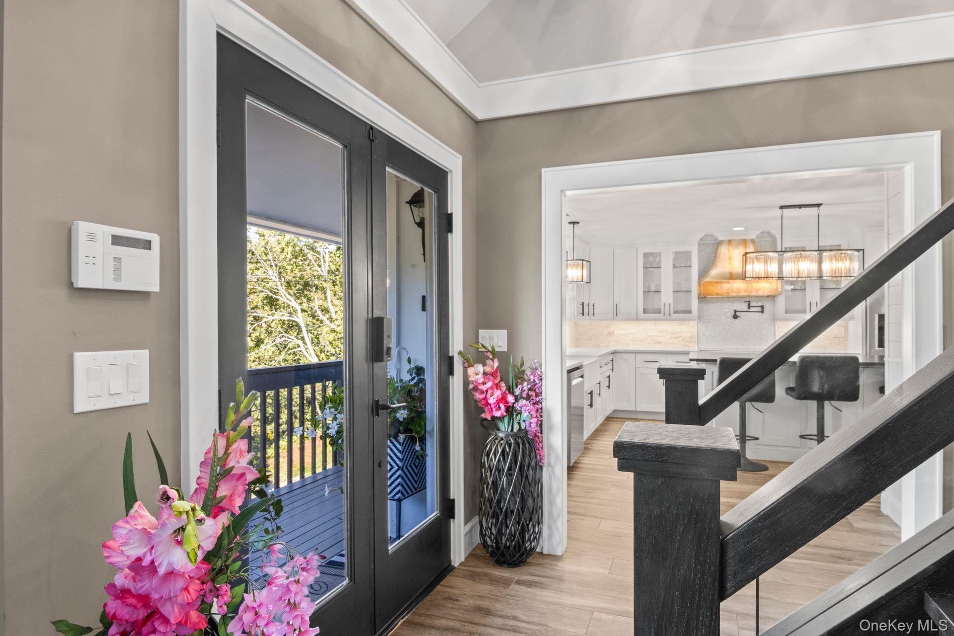 131 Fleets Cove Road Huntington, NY 11743 - Photo 4 of 41 a front view of a house with wooden floor and windows