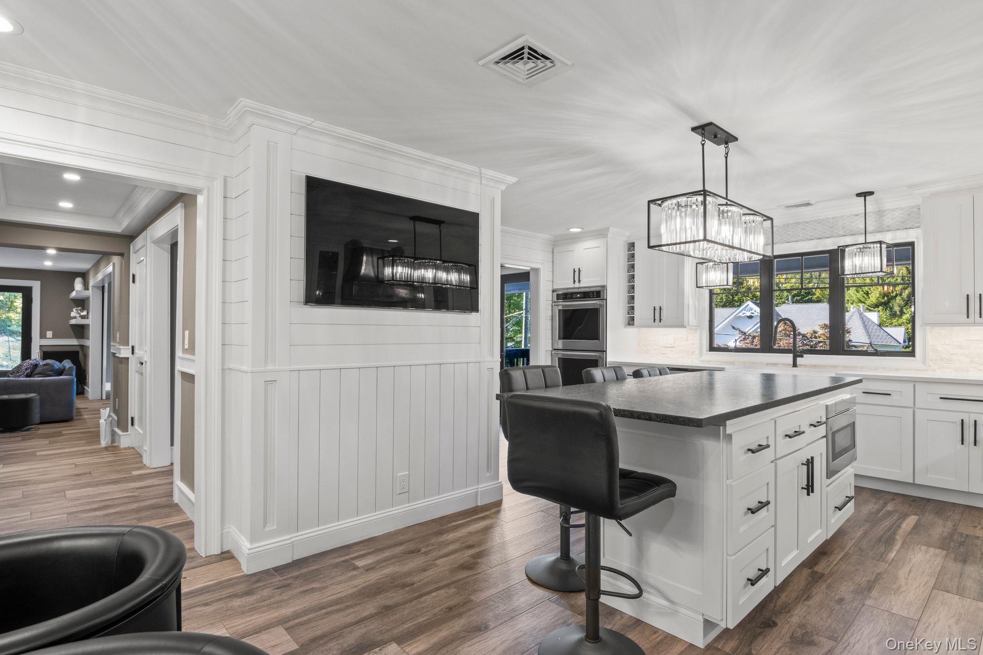 131 Fleets Cove Road Huntington, NY 11743 - Photo 6 of 41 a kitchen with granite countertop a sink a counter space appliances and cabinets