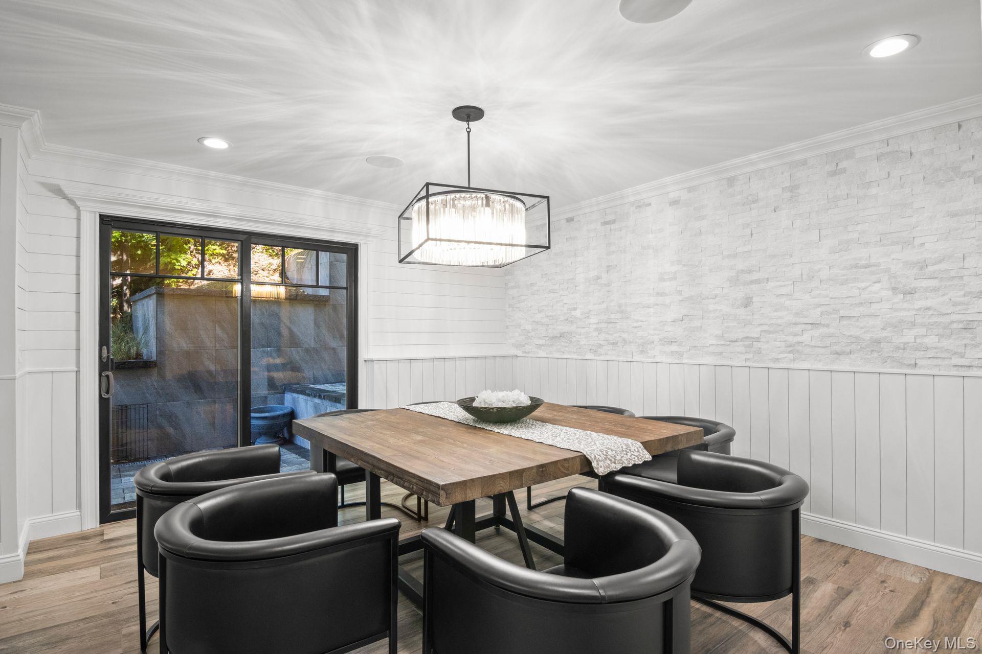 131 Fleets Cove Road Huntington, NY 11743 - Photo 10 of 41 a dining room with a table and chairs