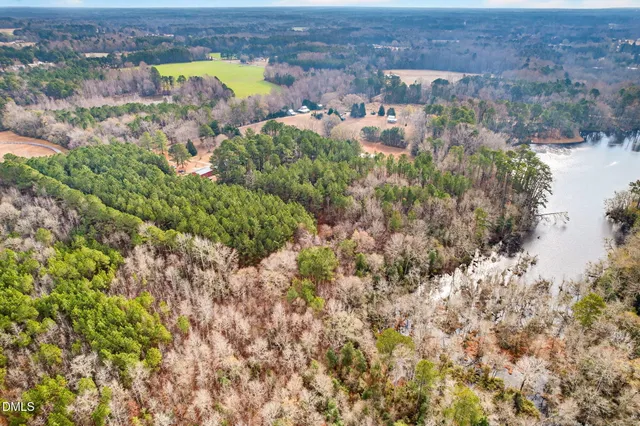 an aerial view of multiple house with a yard