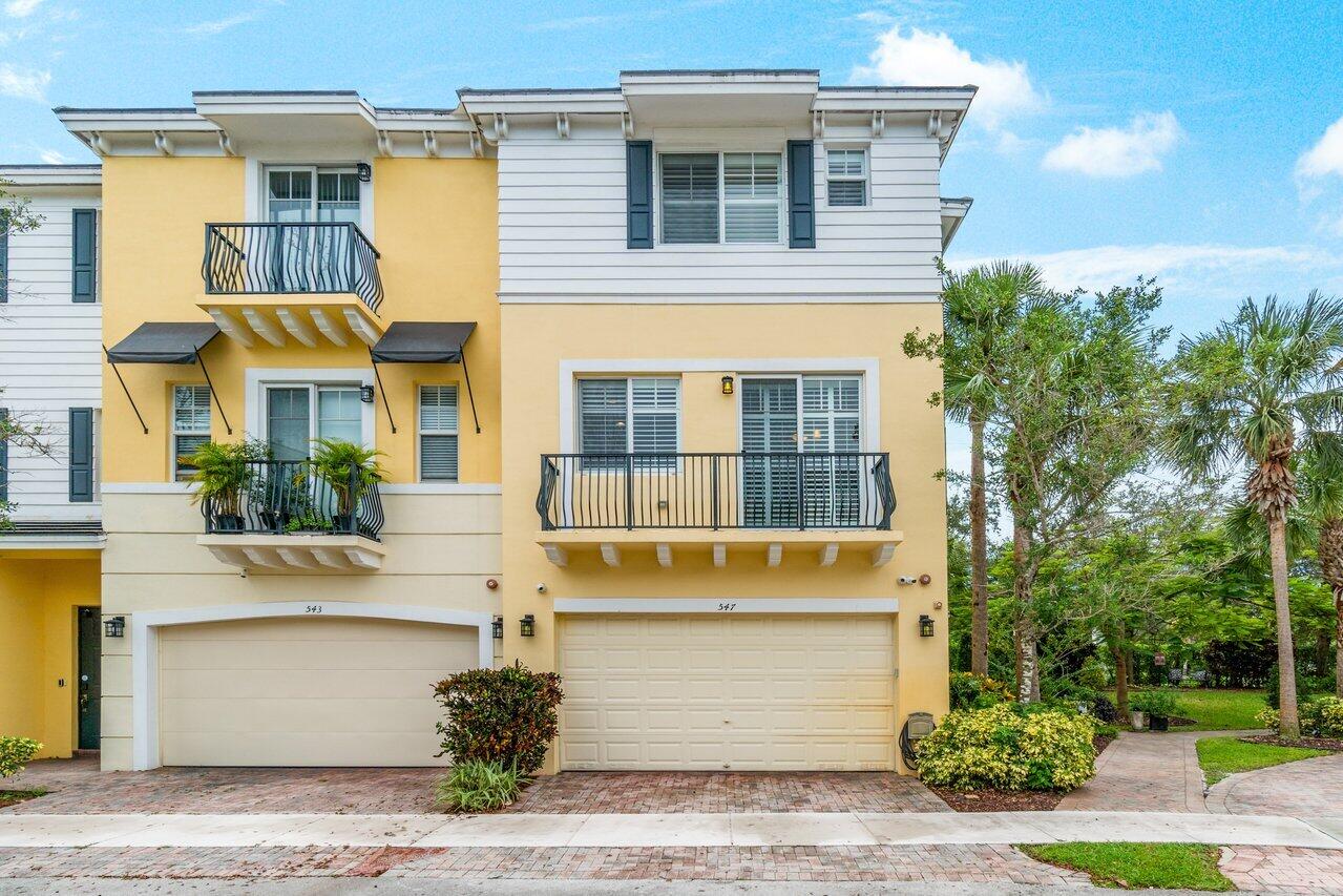 547 Northwest 35th Place Boca Raton, FL 33431 - Photo 3 of 37 a front view of a house with a garden