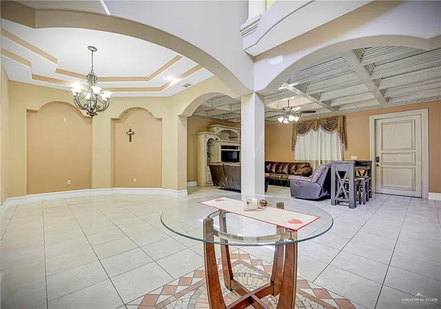 a view of a livingroom with furniture and a chandelier