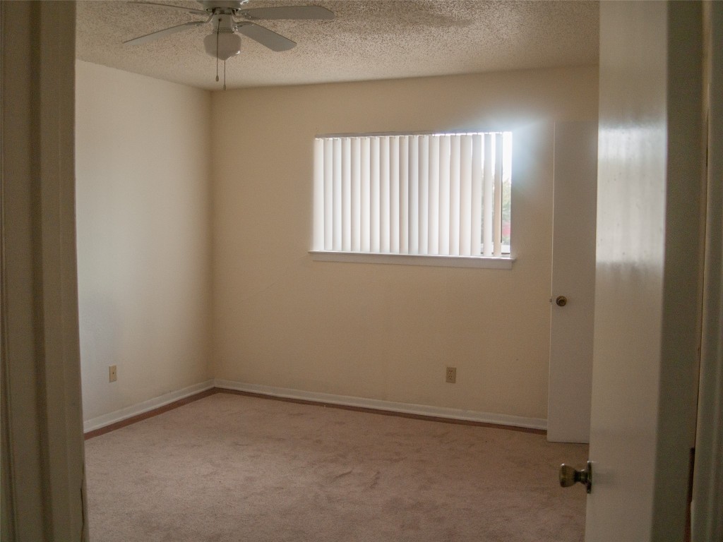 1745 Wooten Park Drive, Unit 101 Austin, TX 78757 - Photo 13 of 19 an empty room with a window