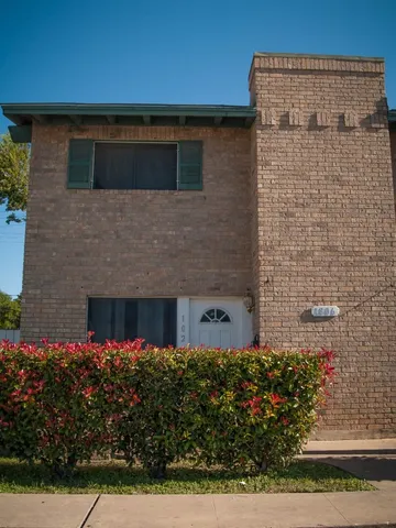 a view of a house with a garden