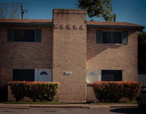 a front view of a house with garage