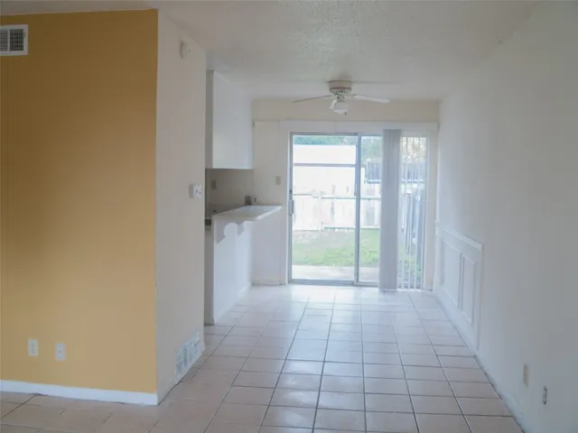 a view of a kitchen with a sink and a window