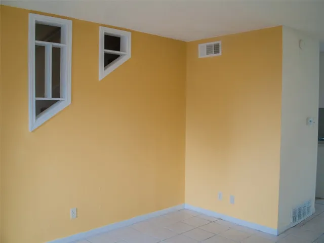 a view of a big room with closet and wooden floor
