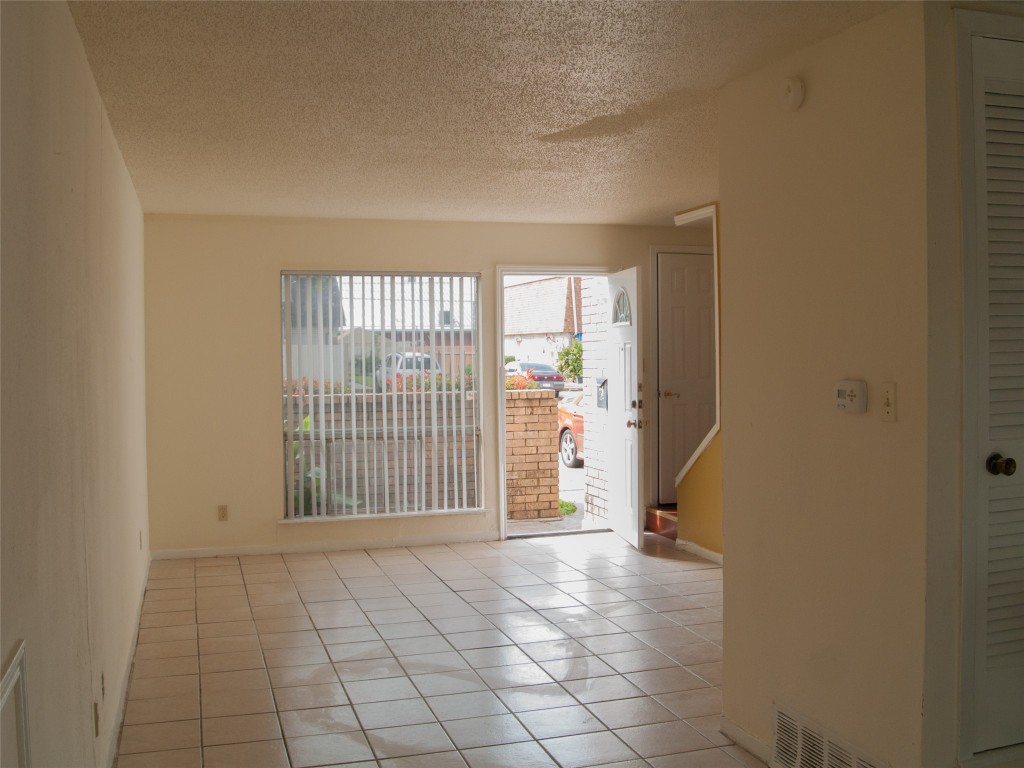 1745 Wooten Park Drive, Unit 101 Austin, TX 78757 - Photo 9 of 19 an empty room with windows