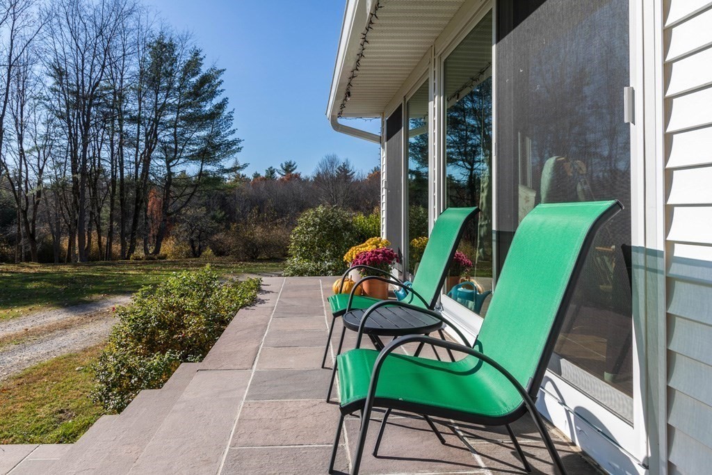 280 Stone Street Gardner, MA 01440 - Photo 16 of 28 a view of a chairs and table in patio with a backyard
