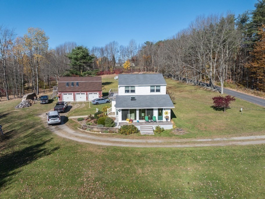 280 Stone Street Gardner, MA 01440 - Photo 22 of 28 a front view of a house with a garden