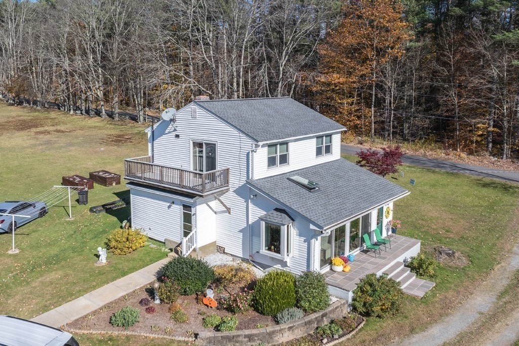 280 Stone Street Gardner, MA 01440 - Photo 23 of 28 an aerial view of a house with a yard