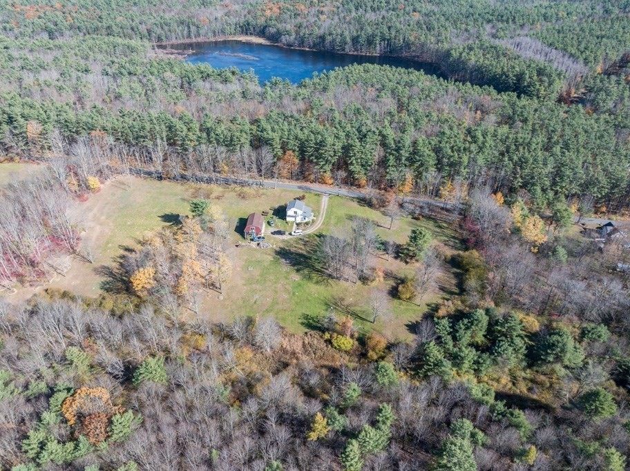 280 Stone Street Gardner, MA 01440 - Photo 26 of 28 a view of a lake with a yard
