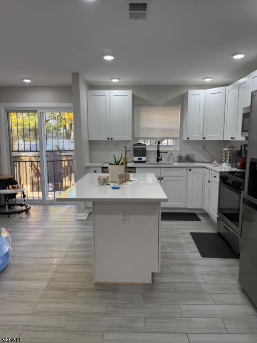 342 South 20th Street Newark, NJ 07103 - Photo 5 of 25 a kitchen with a sink stove and cabinets