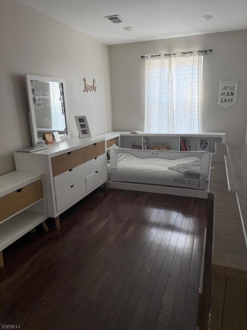 342 South 20th Street Newark, NJ 07103 - Photo 9 of 25 a room with a couch and wooden floor