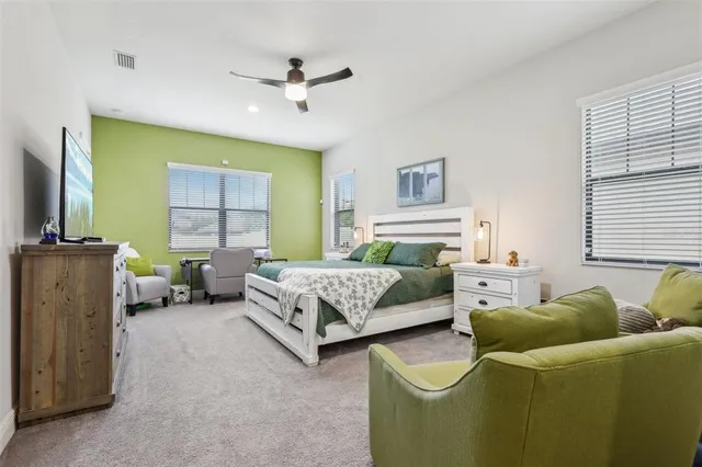 a bedroom with a bed and a couch