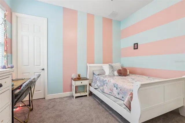 a bedroom with a bed and a table in it