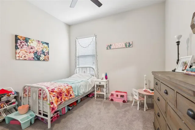 a bedroom with a bed and a table in it