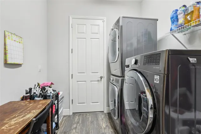 a view of a storage and utility room with washer and dryer