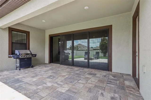 a large bedroom with a large bed and a large window