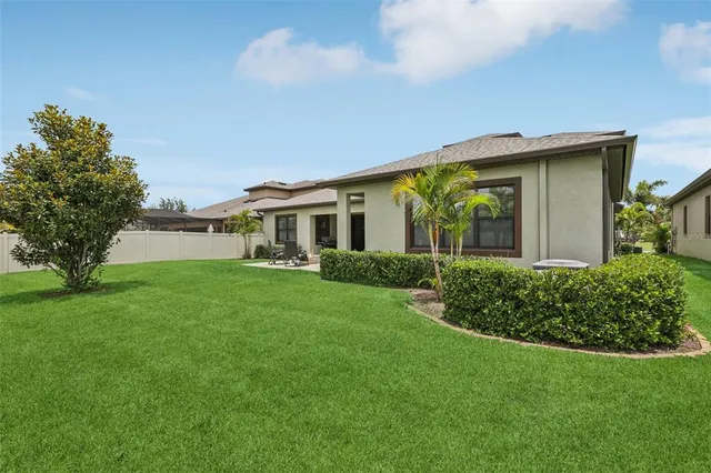 a front view of house with a garden