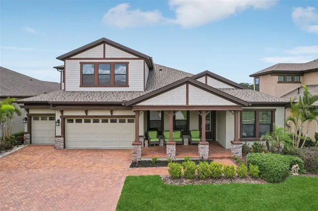 a front view of a house with a yard and porch