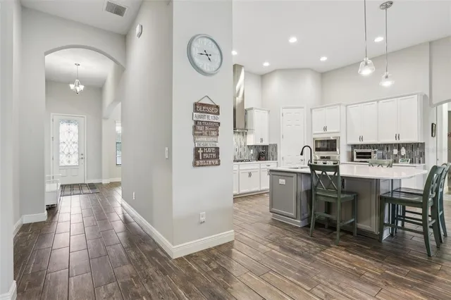 a view of kitchen with cabinets and wooden floor