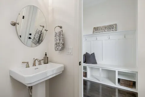 a bedroom with a bed and painting on the wall