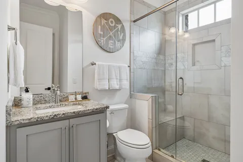 a bedroom with a bed and cabinets