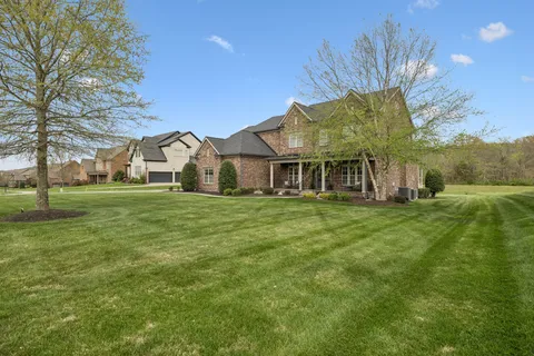 a view of a house with a big yard