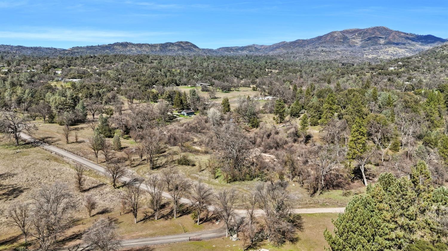 5128 Darrah Road Mariposa, CA 95338 - Photo 3 of 12 a view of a field with a mountain in the background