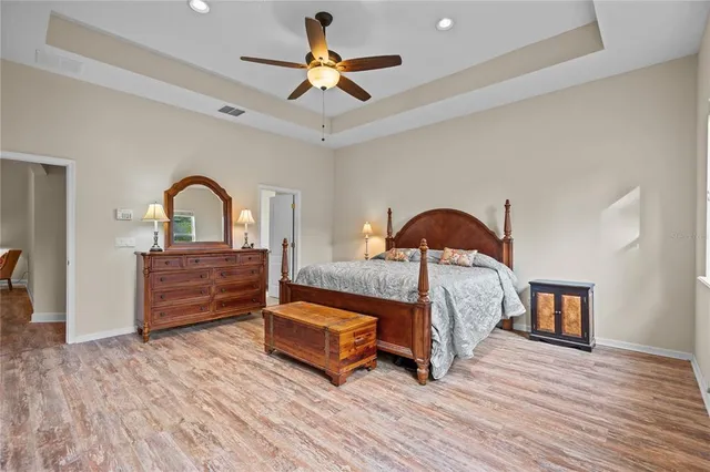 a bedroom with a bed and a dresser