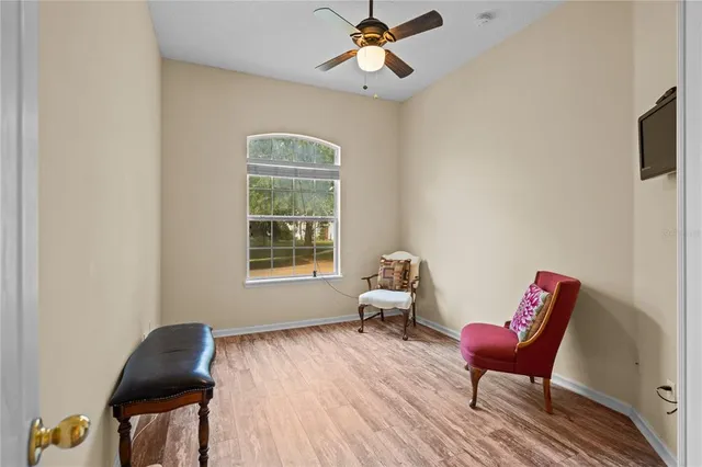 a living room with furniture and a chair