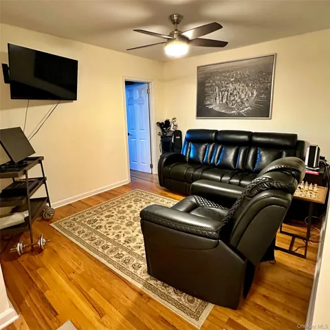 a view of a livingroom with furniture and a flat screen tv