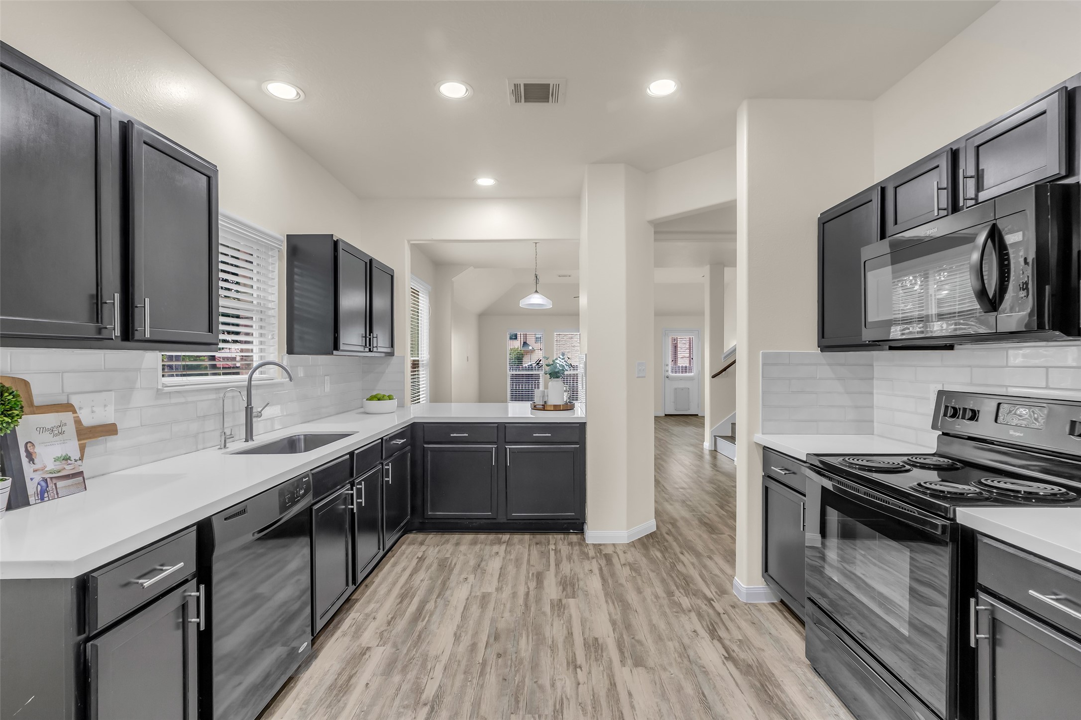 3807 Springcrest Lane Montgomery, TX 77356 - Photo 1 of 31 a large kitchen with stainless steel appliances granite countertop a sink stove and refrigerator