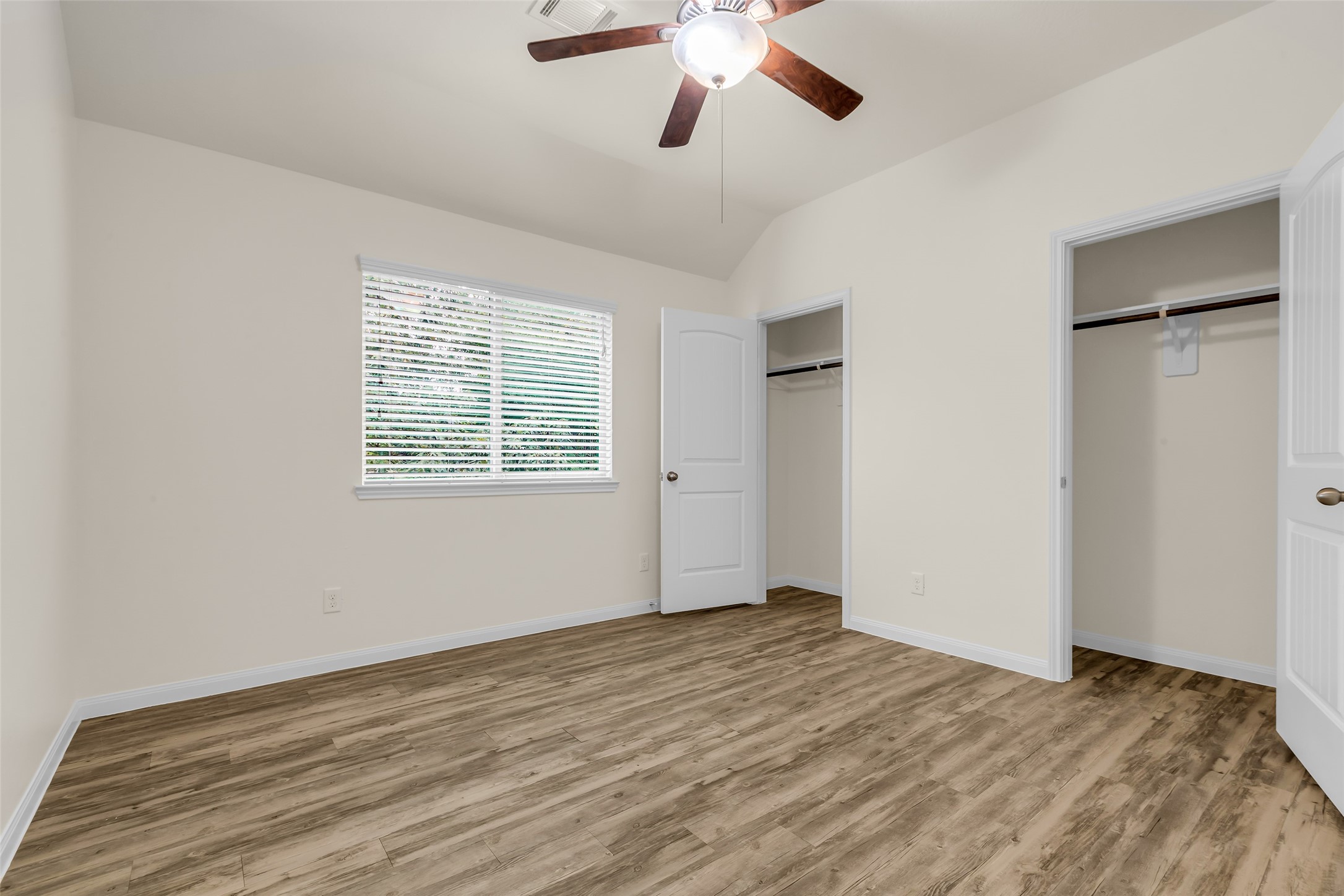 3807 Springcrest Lane Montgomery, TX 77356 - Photo 23 of 31 a view of an empty room with wooden floor and a window