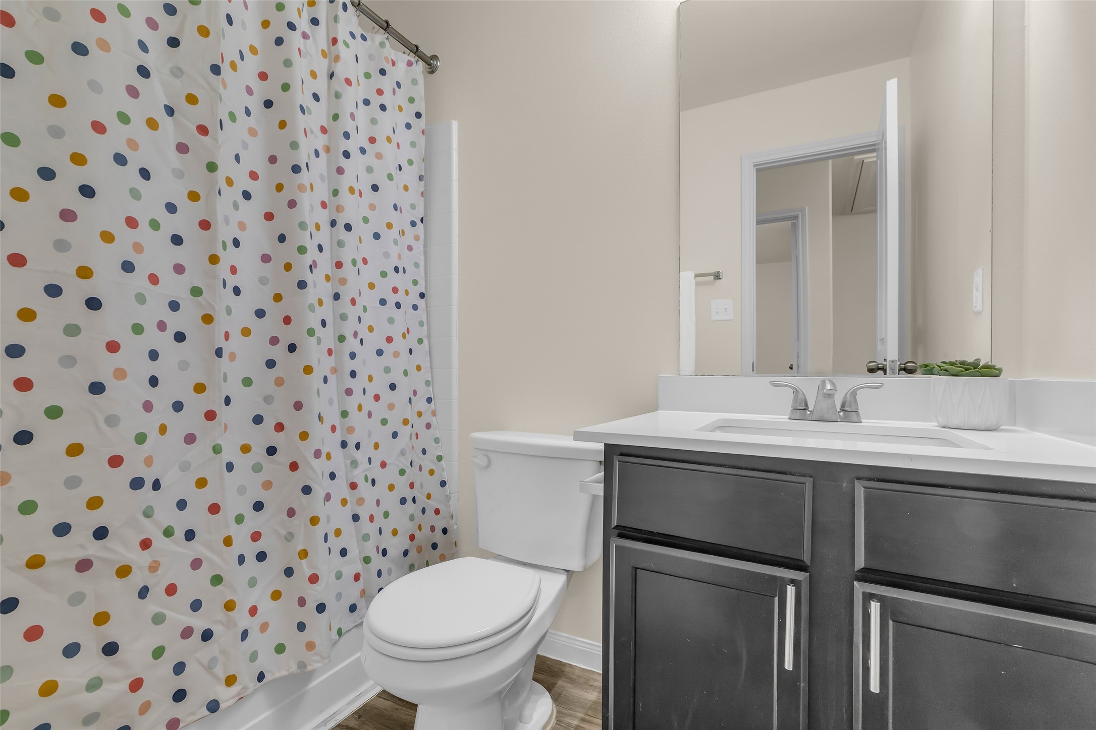 3807 Springcrest Lane Montgomery, TX 77356 - Photo 24 of 31 a bathroom with a sink toilet and a mirror