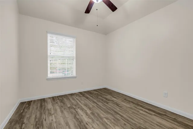 an empty room with a empty space and a window