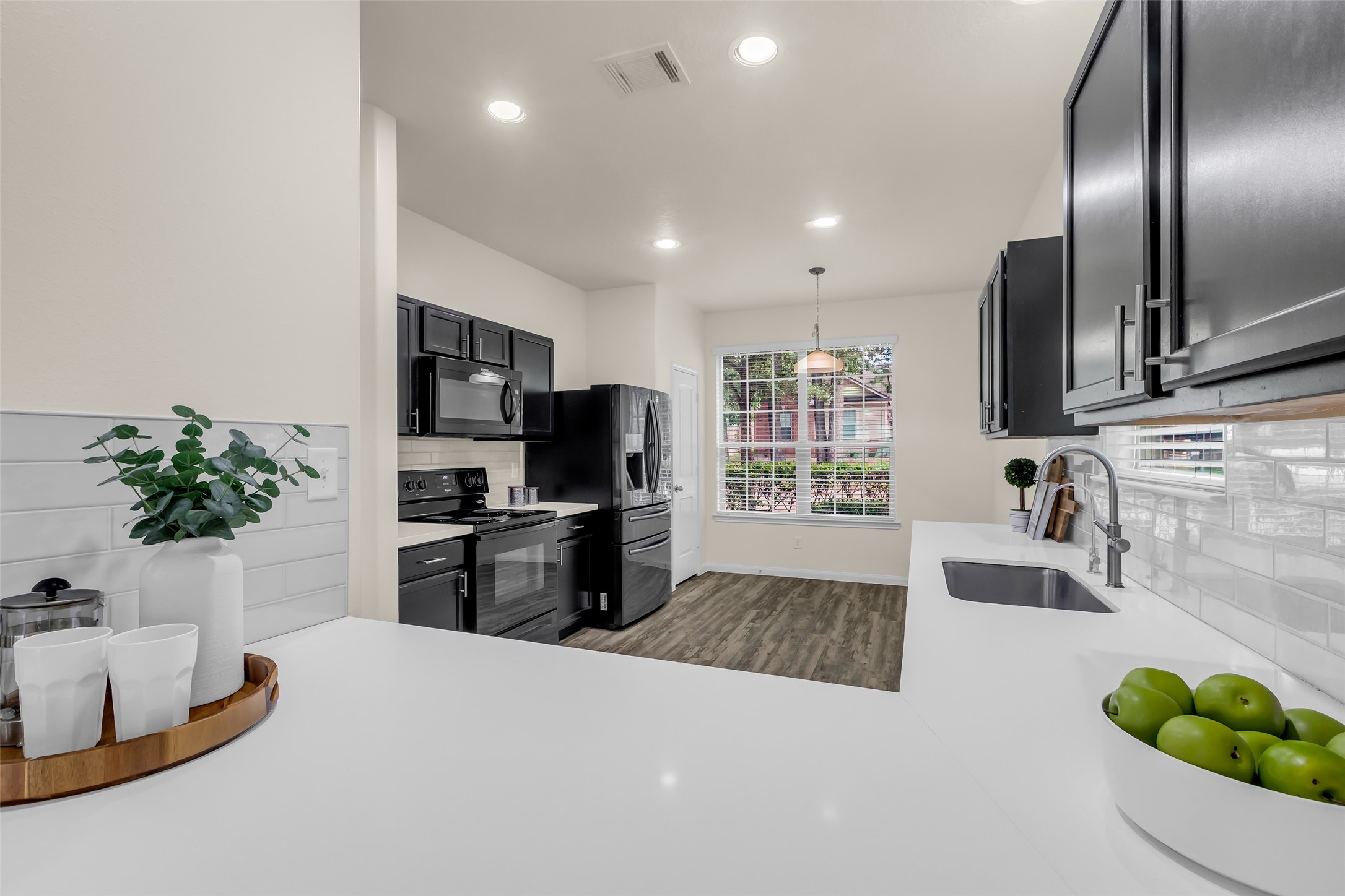 3807 Springcrest Lane Montgomery, TX 77356 - Photo 5 of 31 a kitchen with granite countertop a sink stainless steel appliances and counter space