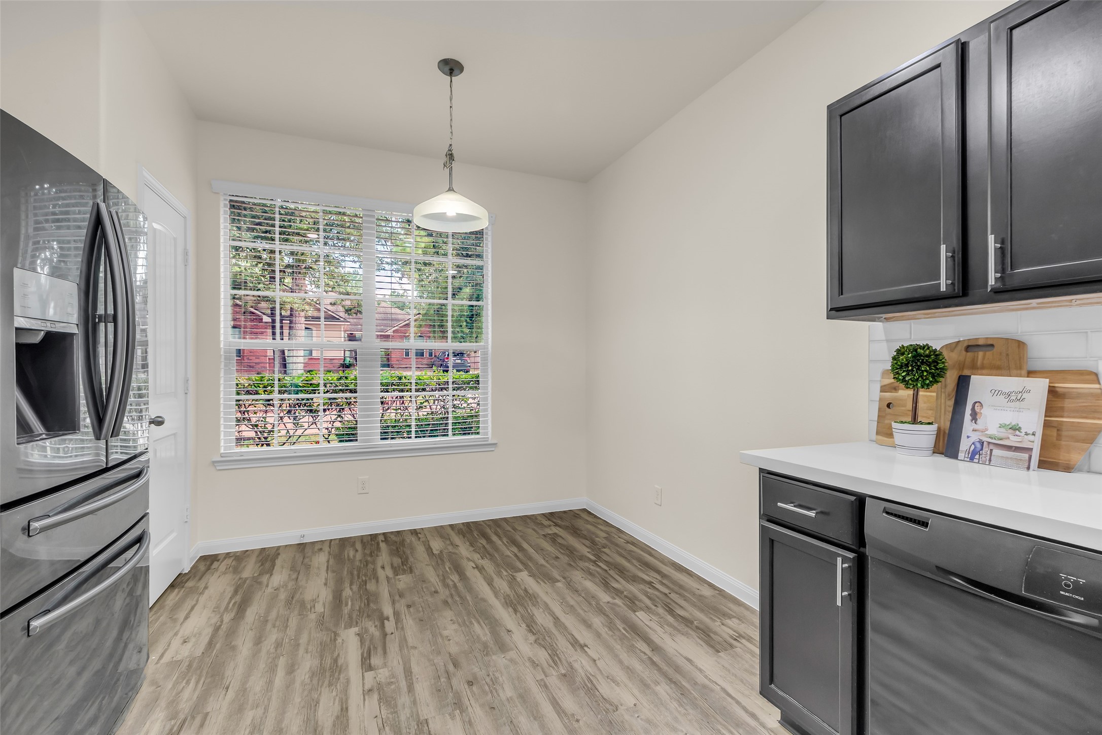 3807 Springcrest Lane Montgomery, TX 77356 - Photo 10 of 31 a room with granite countertop wooden floor and stainless steel appliances