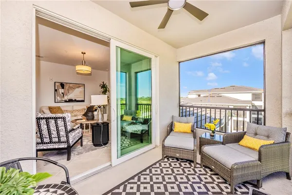 a bathroom with a granite countertop sink and a toilet