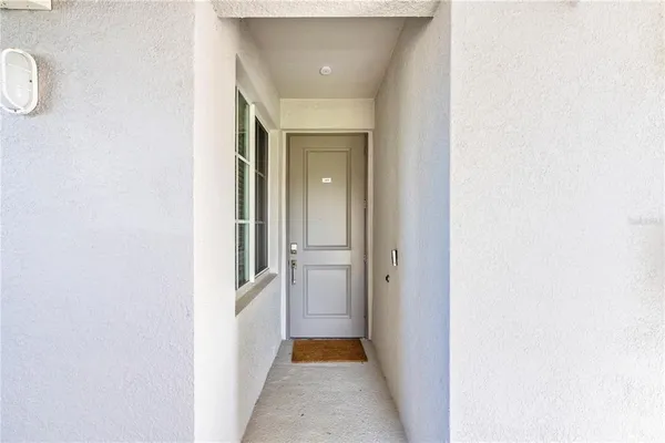 a living room with lots of furniture and a chandelier