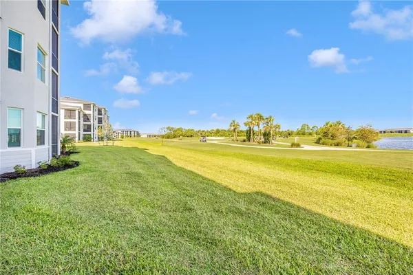 a view of a house with backyard porch and sitting area