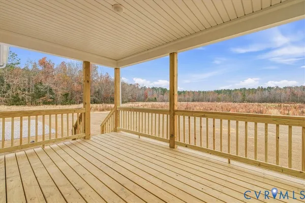 a view of a balcony with wooden floor